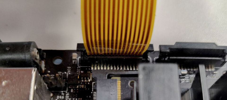 ribbon cable inserted into the bottom of the connector